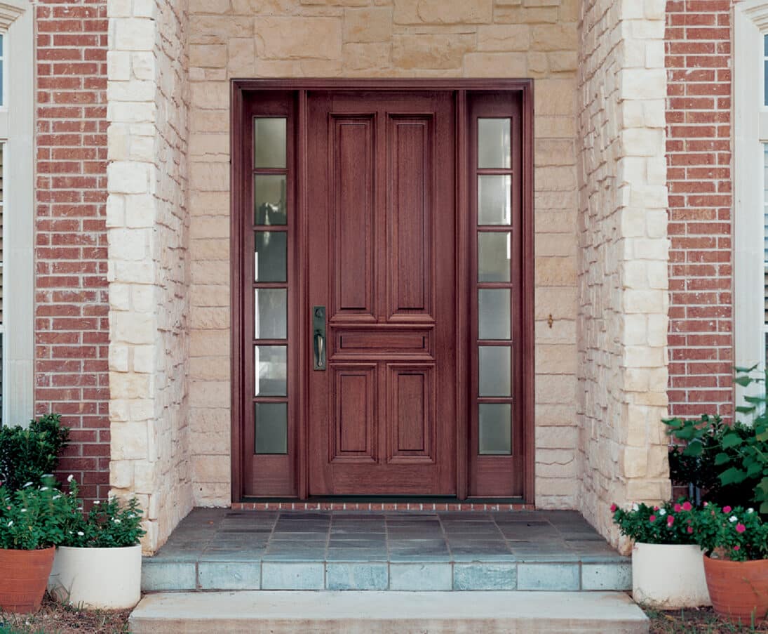 Red stained wood entry door with modern styling.