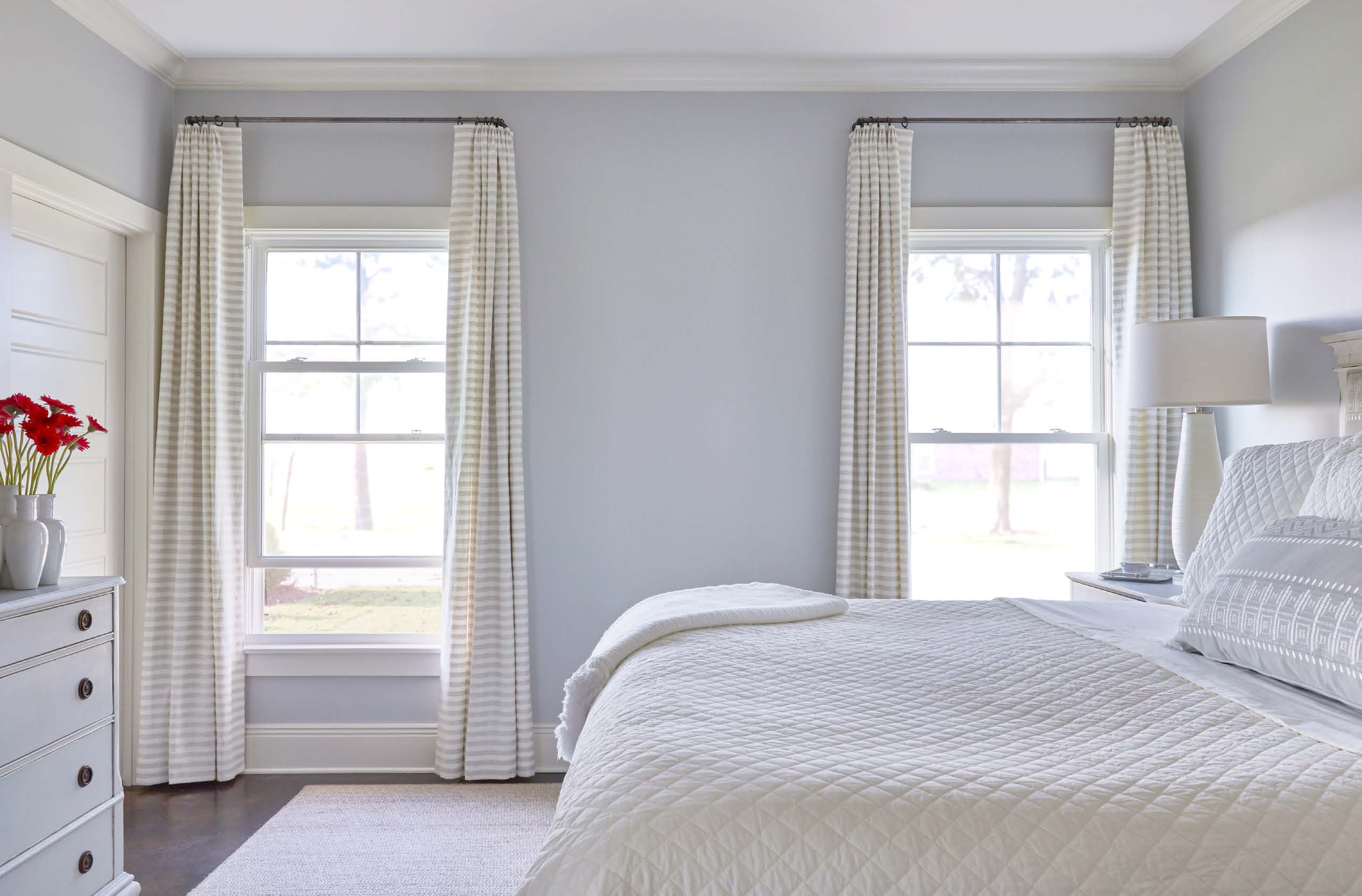 Brightly lit room with two new double hung windows.