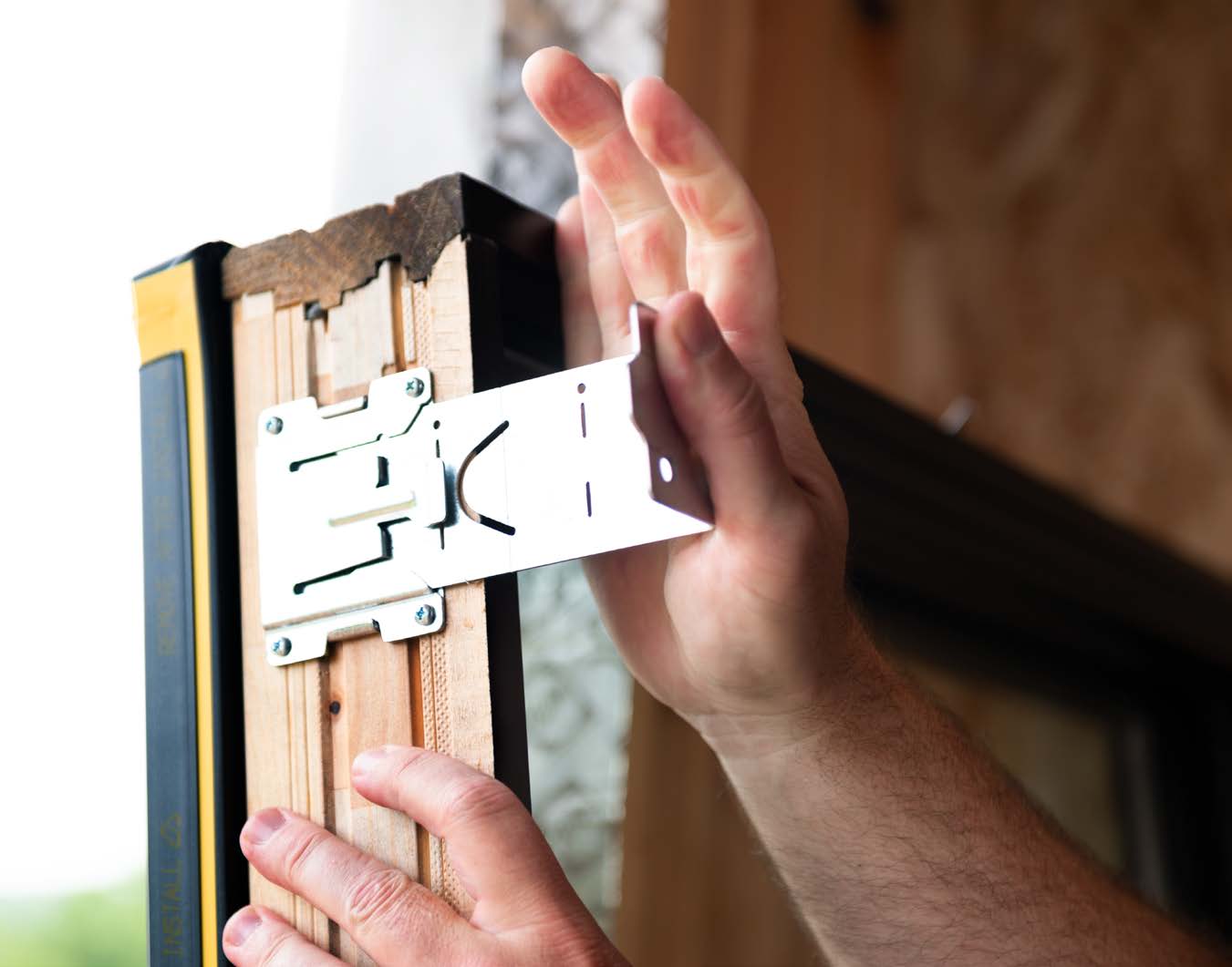 Installing brackets on a new replacement window.